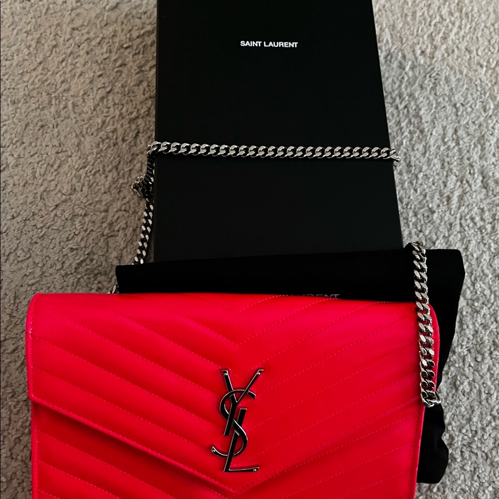 YSL hot pink bag with silver hardware.